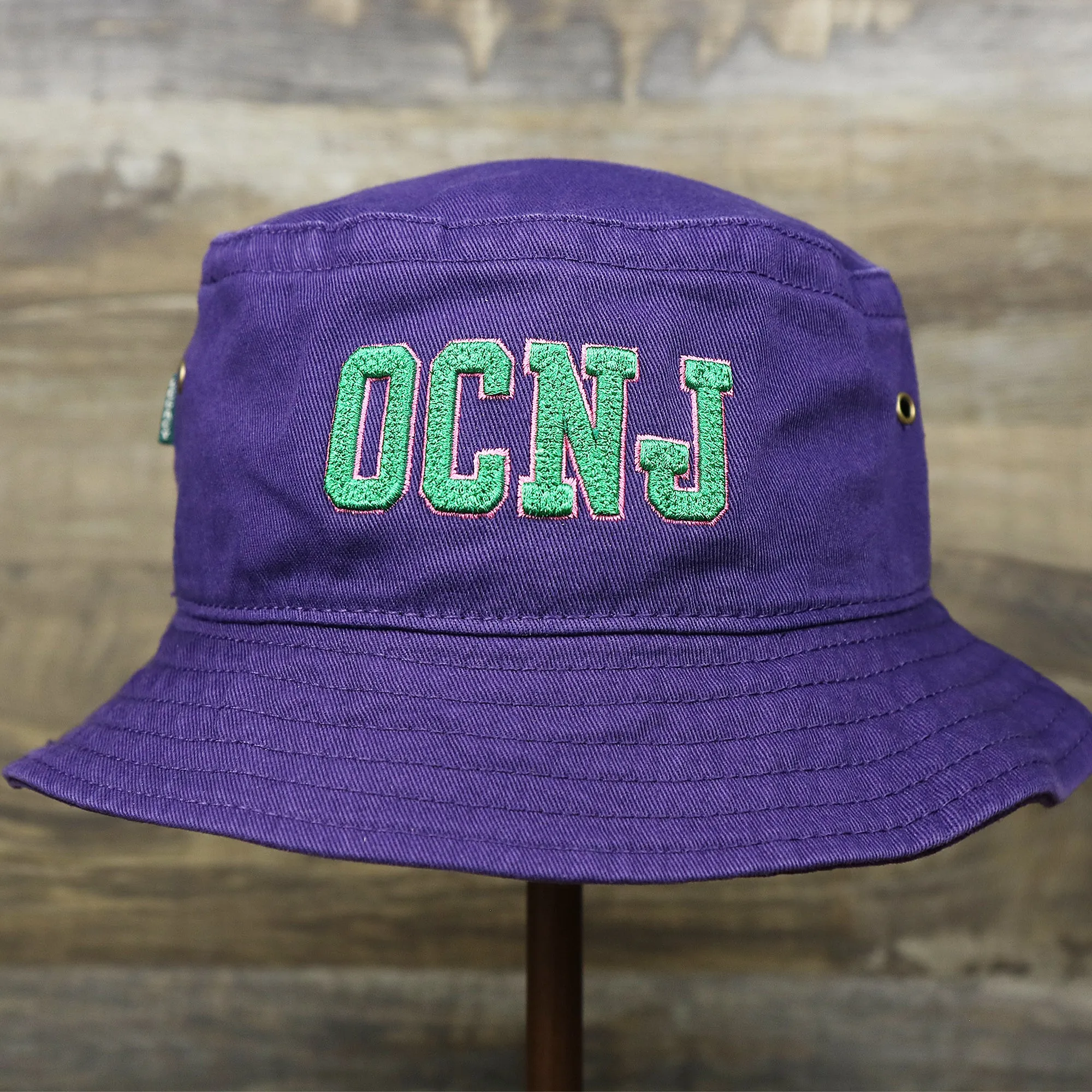 Green OCNJ Double Wordmark Pink Outline Bucket Hat | Purple Bucket Hat